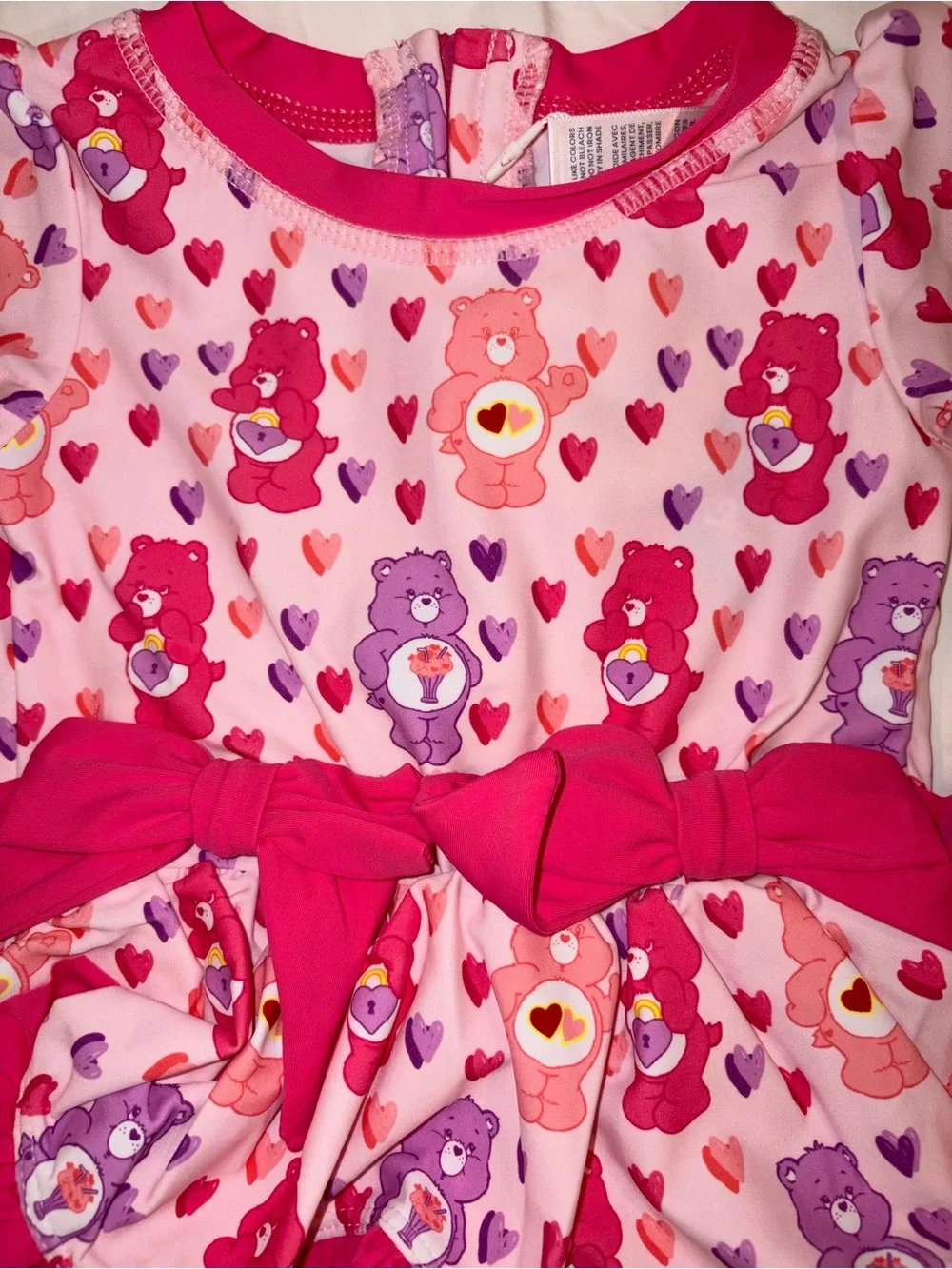 Ruffle Butts X Care Bears 1 piece swimsuit/rashguard sz 18-24 months NWT